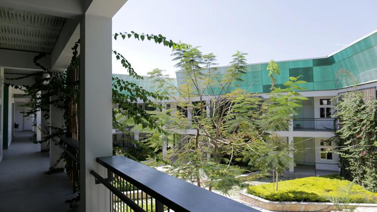 Photo of GHESKIO Tuberculosis Hospital, View of Courtyard from Second Level Exterior Hallway