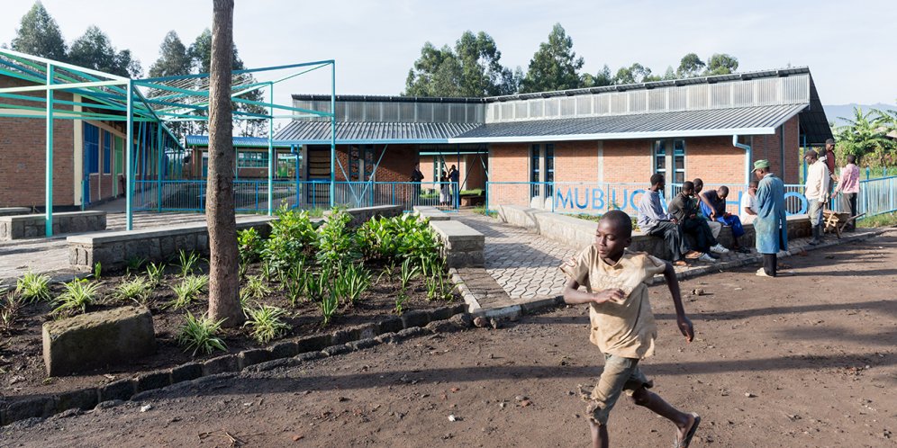 Photo of Mubuga Primary School, Photo by Iwan Baan, Exterior of the school building with children running past