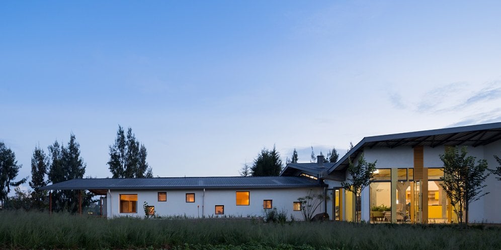 Photo of Butaro Ambulatory Cancer Center, Photo by Iwan Baan, Totality of the Building Exterior Nighttime View