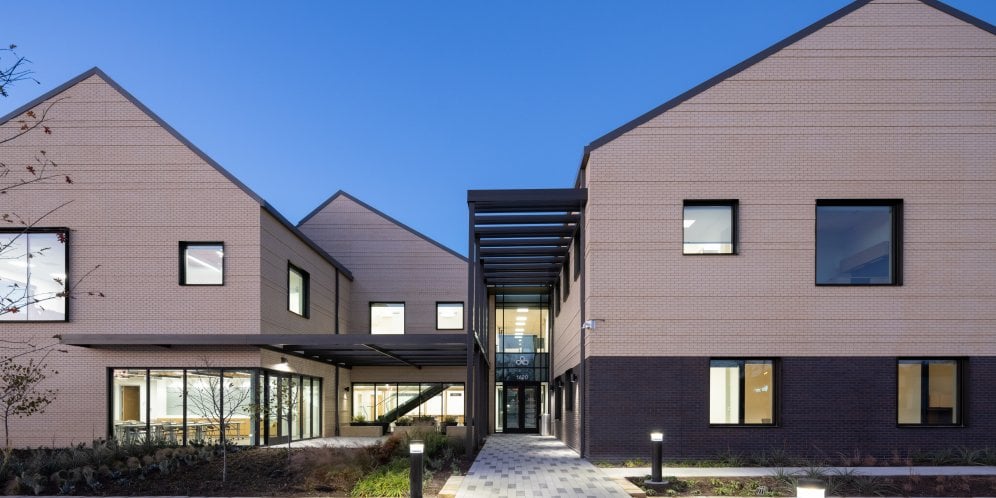 Exterior of the health center's entry at sunset