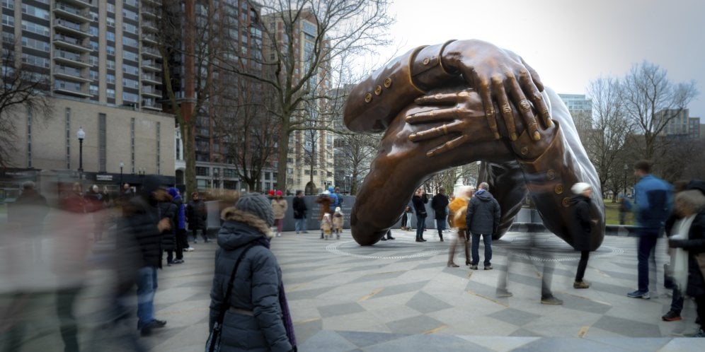 The Embrace. Visitors gather around the Memorial on MLK Day