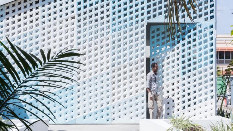 Photo of GHESKIO Cholera Treatment Center, Photo by Iwan Baan, daytime photograph of the metal facade and side entry