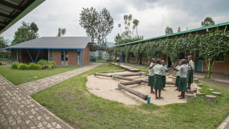 Photo of Mubuga Primary School, children gather in the inner yard
