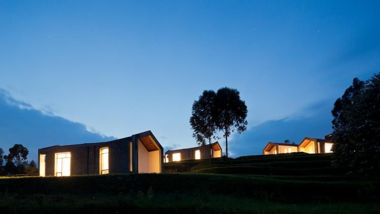 Photo of Butaro Doctors' Housing, Photo by Iwan Baan, Nightime Exterior View of the Housing and Landscape