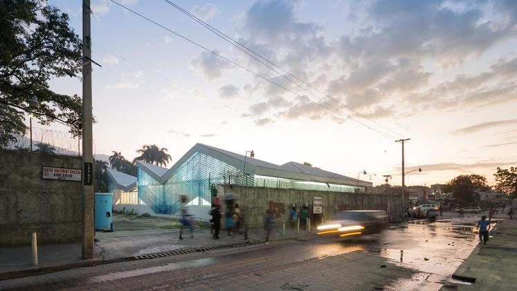 Photo of Gheskio Cholera Treatment Center, Photo by Iwan Baan, Exterior Nighttime View of Port-au-Prince Street and Building Facade