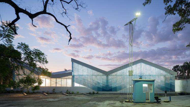 Photo of Gheskio Cholera Treatment Center, Photo by Iwan Baan, Exterior Nighttime View of the Cholera Treatment Center with Gatehouse